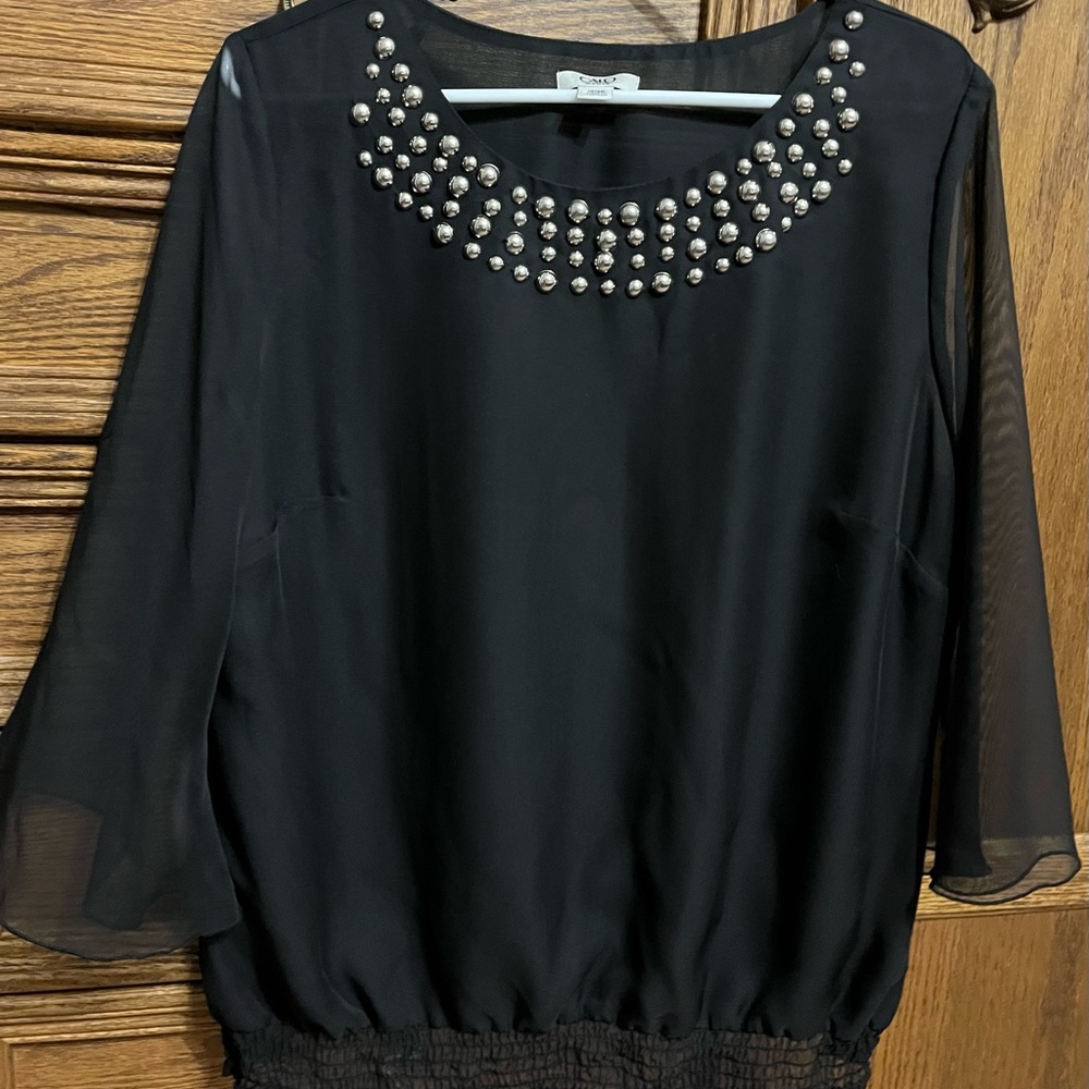 Cato brand black top with silver accents around neckline, size 14W/16W